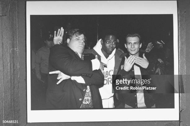Actors Chris Farley, Chris Rock & Christian Slater clowning around as they arrive at the opening of the Planet Hollywood restaurant.