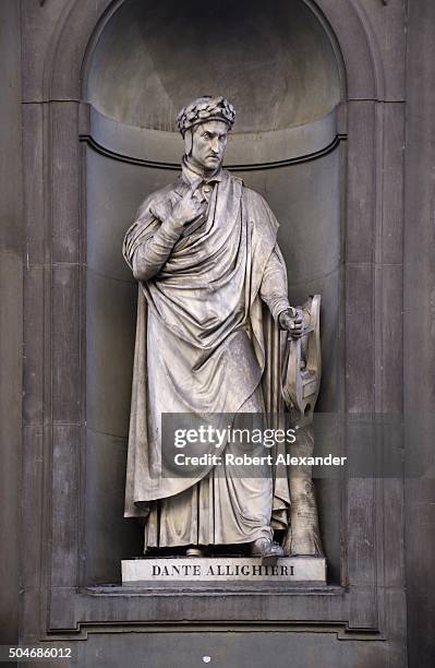 Marble statue of the Italian poet and writer Dante Alighieri is among the statues of notable Italians outside the Ufizzi Gallery in Florence, Italy.