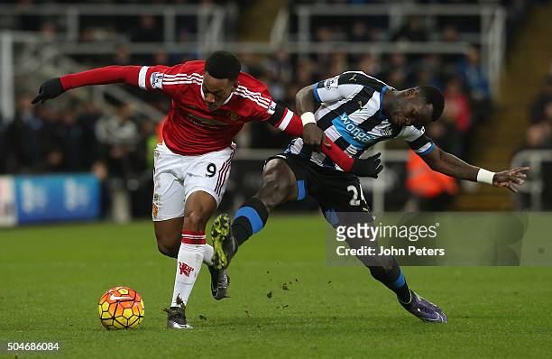 Anthony Martial of Manchester United in action with Cheick Tiote of Newcastle United during the Barclays Premier League match between Newcastle...