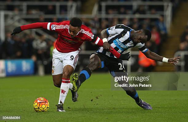 Anthony Martial of Manchester United in action with Cheick Tiote of Newcastle United during the Barclays Premier League match between Newcastle...