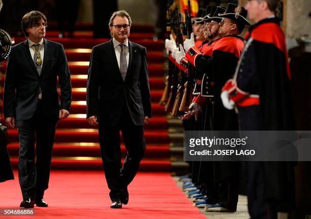 Outgoing President of the Catalan Government and leader of the Catalan Democratic Convergence Artur Mas and new elected President of the Catalan...