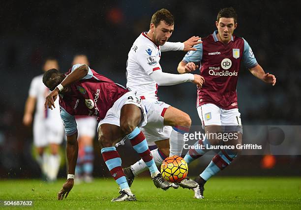 James McArthur of Crystal Palace goes between Aly Cissokho and Jordan Veretout of Aston Villa during the Barclays Premier League match between Aston...