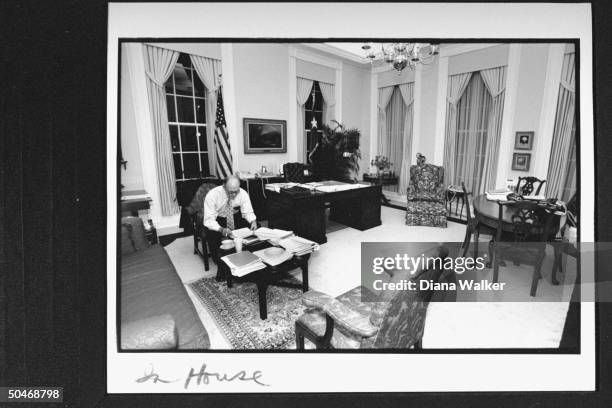 Adv. Brent Scowcroft in shirt-sleeves, going over some papers as he sits at coffee table next to large desk in his commodious office at the WH late...