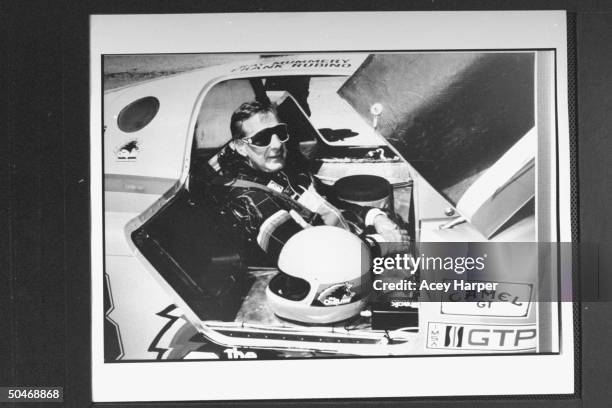 Photo of Panama's Gen. Manuel Noriega's defense attorney Frank Rubino in race car during auto race.;1985