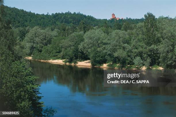 The Gauja River, with Turaida castle in the background, Sigulda, Latvia.