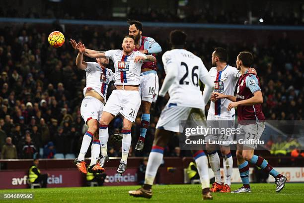 Joleon Lescott of Aston Villa outjumps the Crystal Palace defence to score their first goal with a header during the Barclays Premier League match...