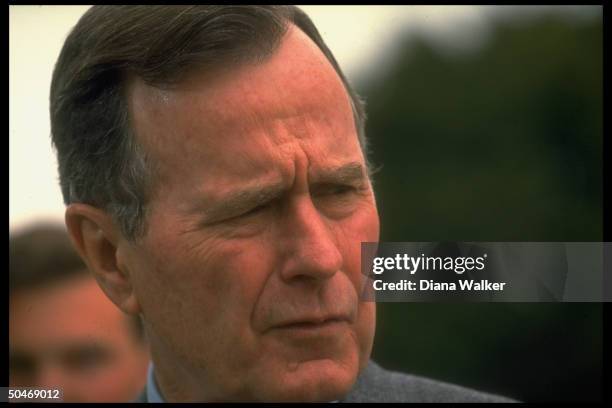 Pres. Bush responding to press query re Iraqi Pres. Saddam Hussein while leaving Bethesda Naval Hospital after physical.