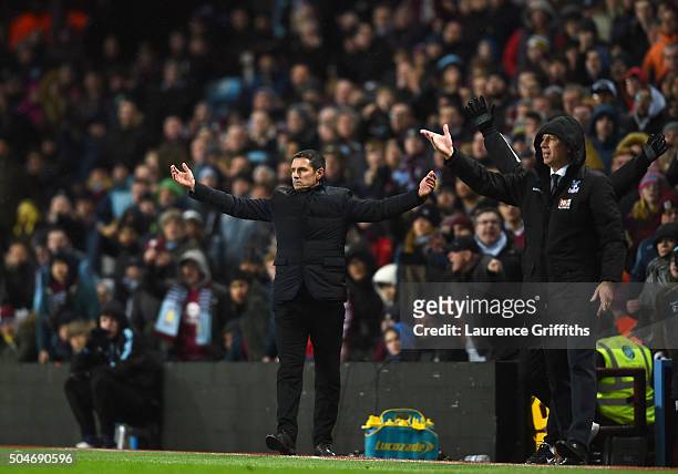Remi Garde manager of Aston Villa and Alan Pardew manager of Crystal Palace react during the Barclays Premier League match between Aston Villa and...