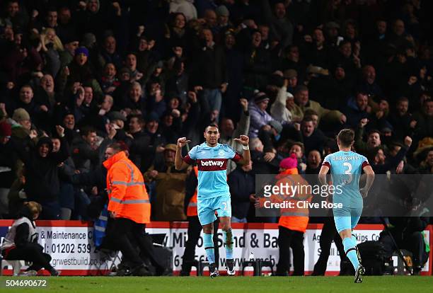Dimitri Payet of West Ham United celebrates with fans as he scores their first and equalising goal from a free kick during the Barclays Premier...