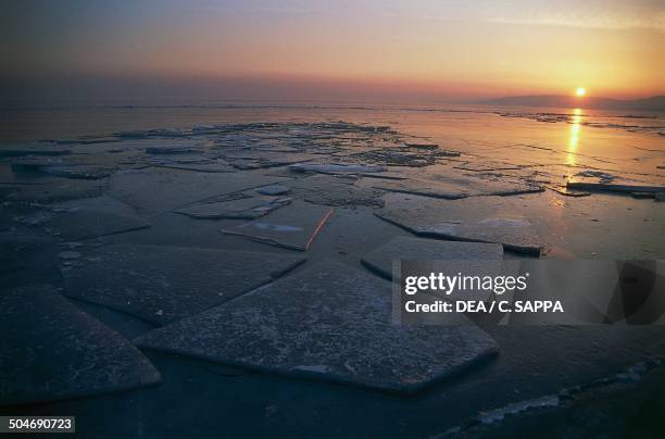 Frozen Lake Balaton at sunset, Hungary.