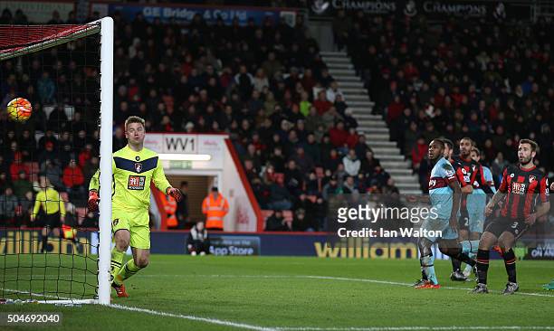 Goalkeeper Artur Boruc of Bournemouth watches the ball as Enner Valencia of West Ham United scores their third goal during the Barclays Premier...