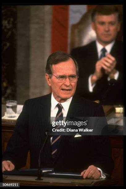 Pres. Bush addressing Joint Session of Congress, framed by Sen. Pres. VP Dan Quayle & flag backdrop.