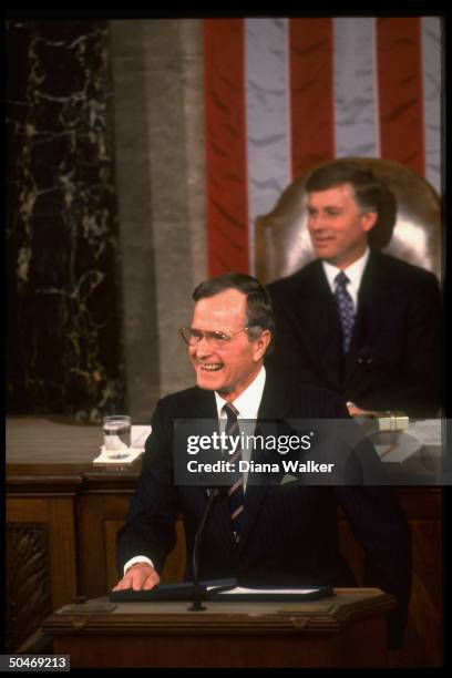 Pres. Bush addressing Joint Session of Congress, framed by Sen. Pres. VP Dan Quayle & flag backdrop.