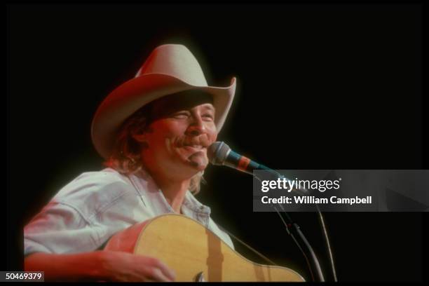 Musician Alan Jackson performing in concert .