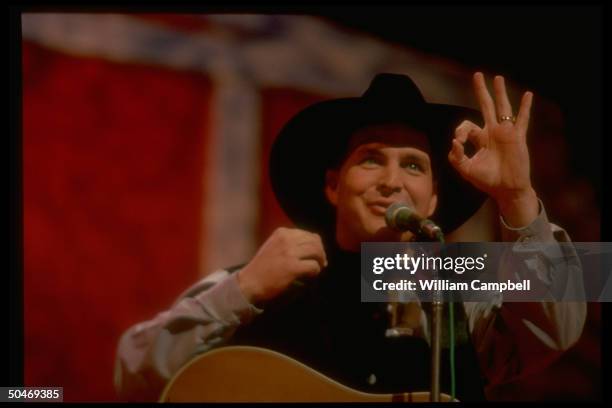 Musician Garth Brooks performing on stage of Grand Ole Opry.