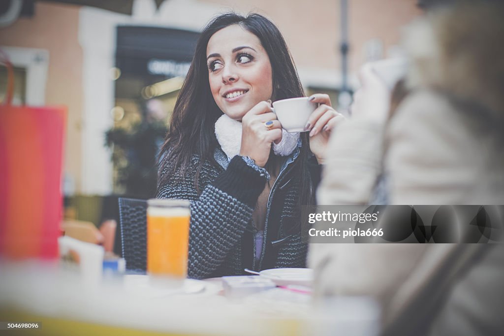 Women take a coffee during shopping