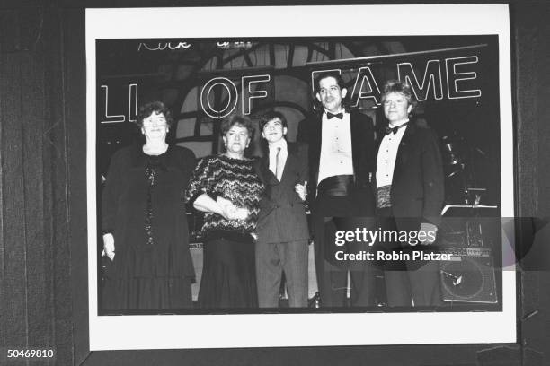 Musician John Fogerty posing w. Family of late rock promoter Bill Graham incl. His 1st wife Bonnie, Bill's sister Esther Chichinsky & his sons David...