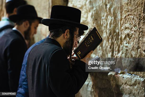 daily prayer at western wall, old city, jersalem, israel - orthodox judaism stock pictures, royalty-free photos & images