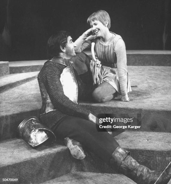 Actress Julie Harris laughing as unident. Actor holds up a leek in The Lark.