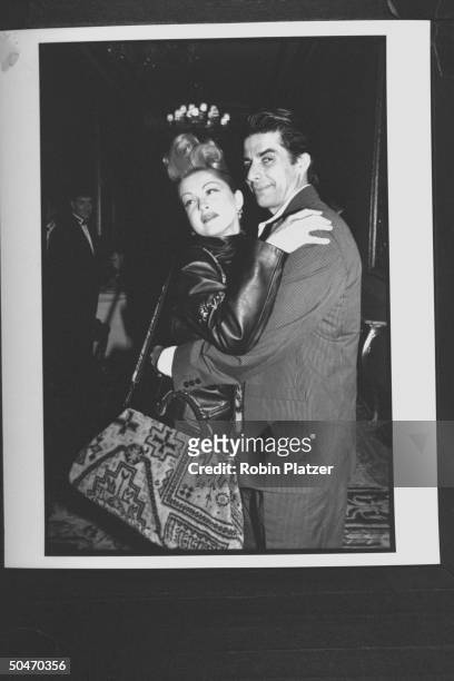 Singer Cyndi Lauper embracing her actor husband David Thornton at Radio City Music Hall for the Grammy Awards ceremony.