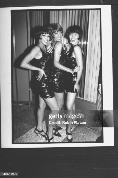 Ray Charles's Diet Pepsi-ettes trio sporting their sequinned miniskirts while striking a provocative pose at Grammy Awards party.