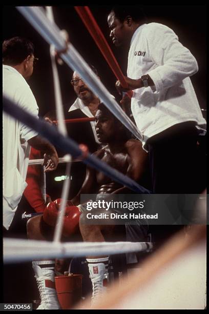 October 2, 1980 - Las Vegas: Defeated boxer Muhammad Ali , with trainer Angelo Dundee and Dr. Donald Romeo, after Dundee stopped fight vs. Larry...