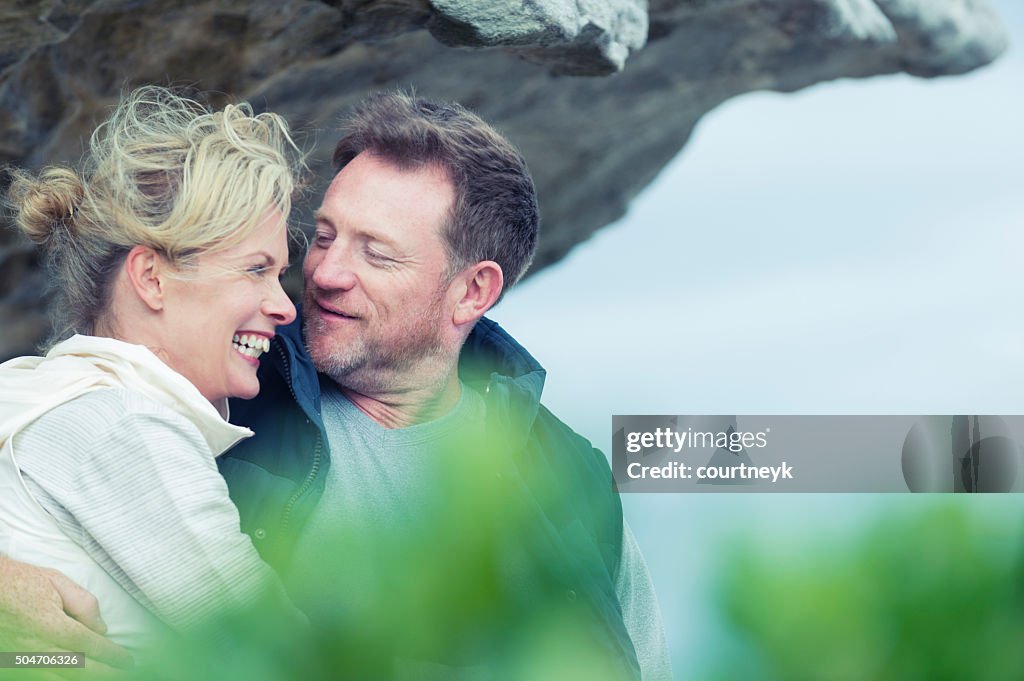 Happy mature couple at the beach.