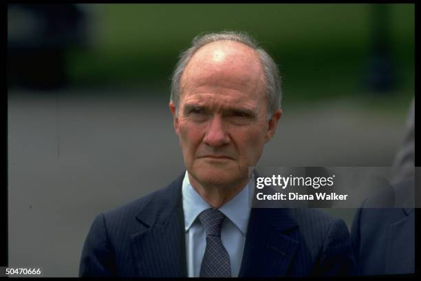 Adviser Brent Scowcroft poised on WH lawn .