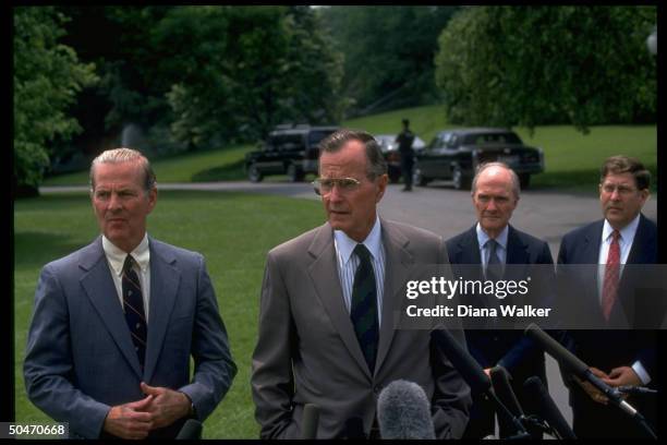 Pres. Bush speaking to press on WH lawn, leaving for Camp David, w. Aides Sununu, Scowcroft & Baker in tow.