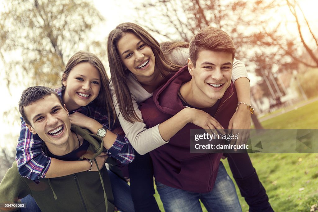 Group of happy teenage friends having fun