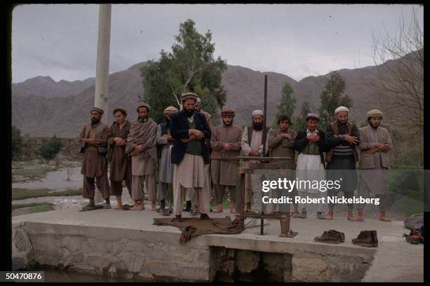 Afghan ethnic Pathan mujahedin offering prayers in rebel-controlled Kunar province capital Asadabad.