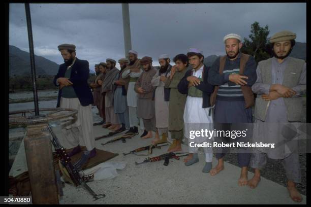 Afghan ethnic Pathan mujahedin offering prayers in rebel-controlled Kunar province capital Asadabad.