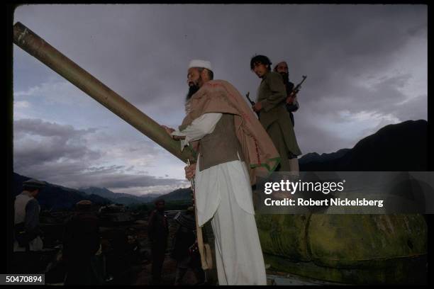 Ethnic Pathan mujahedin based in Salafiya rebel-controlled Kunar province, poised atop old Afghan tank fr. King Zahir Shah period. IN/NR Asadabad.