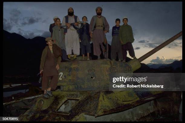 Ethnic Pathan mujahedin based in Salafiya rebel-controlled Kunar province, poised atop old Afghan tank fr. King Zahir Shah period. IN/NR Asadabad.