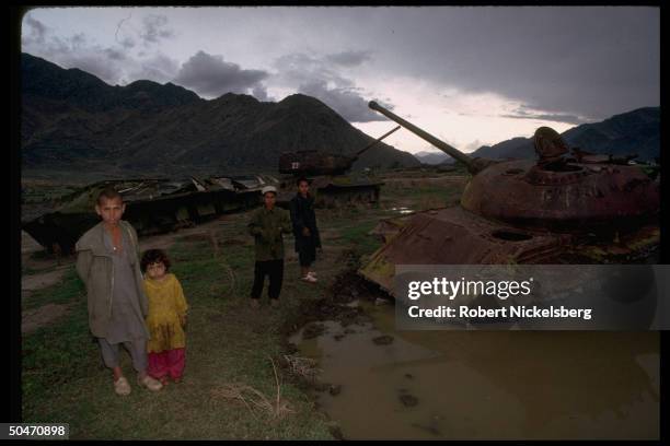 Children poised by old Afghan tank fr. King Zahir Shah period, in Salafiya mujahedin rebel-controlled Kunar province.