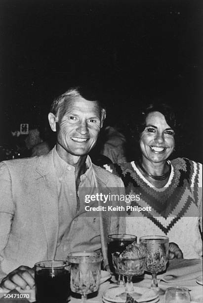 Snapshot of church builder Roe Messner w. His wife Ruth Ann sitting at table in restaurant; Roe has been a close friend & business associate of PTL...