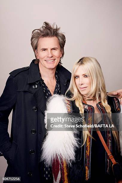 Bass guitarist and co-founder of new wave band Duran Duran, John Taylor and Gela Nash pose for a portrait at the BAFTA Los Angeles Awards Season Tea...