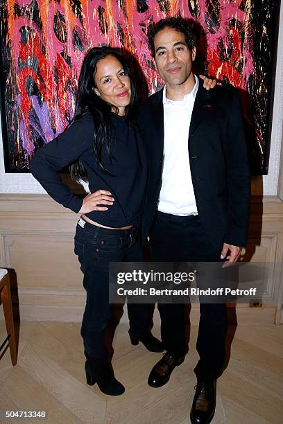 Artist JonOne and his wife Mai Lucas Perello attend the Guerlain collaboration with Graffiti Artist JonOne, Color Flows Exhibition Launch's Cocktail...