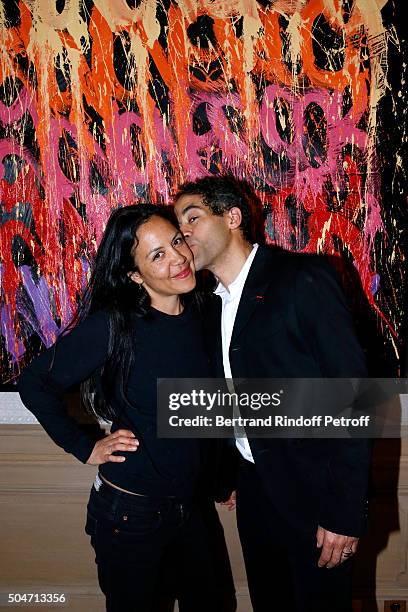 Artist JonOne and his wife Mai Lucas Perello attend the Guerlain collaboration with Graffiti Artist JonOne, Color Flows Exhibition Launch's Cocktail...