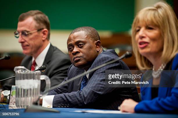 Rep. Tim Murphy , and forensic pathologist and neuropathologist Dr. Bennet Omalu , participate in a briefing sponsored by Rep. Jackie Speier , right,...