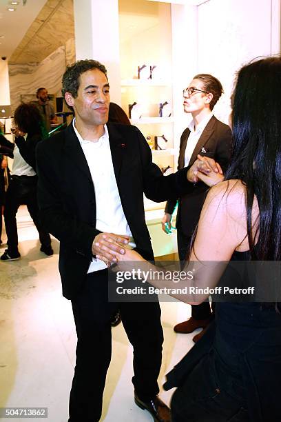 Artist JonOne and his wife Mai Lucas Perello dance during the Guerlain collaboration with Graffiti Artist JonOne, Color Flows Exhibition Launch's...