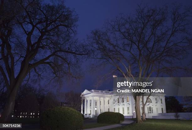 January 12, 2016 photo shows the White House at dusk in Washington, DC. US President Barack Obama is set to deliver his final State of the Union...