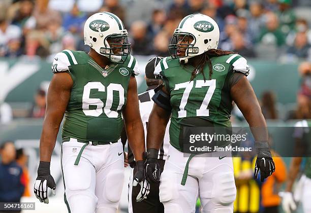 Brickashaw Ferguson and James Carpenter of the New York Jets in action against the New England Patriots on December 27, 2015 at MetLife Stadium in...