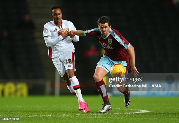 Rob Hall of MK Dons and Joey Barton of Burnley during the Sky Bet Championship match between MK Dons and Burnley at Stadium mk on January 12, 2016 in...