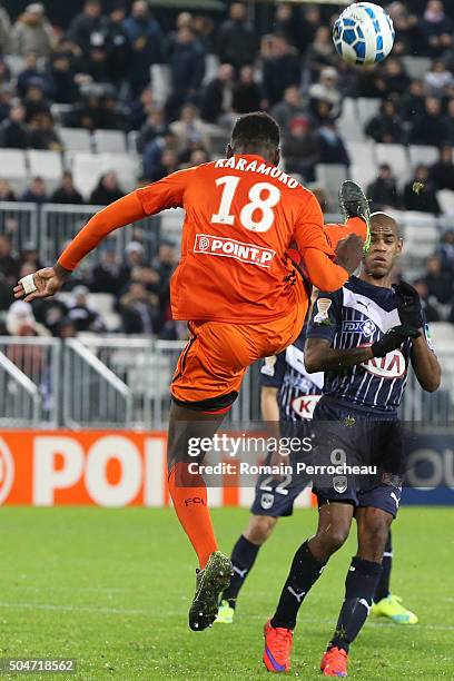 Hamadou Karamoko for Lorient kick the ball in front Diego Rolan for Bordeaux during the French League Cup quarter final between Bordeaux and Lorient...