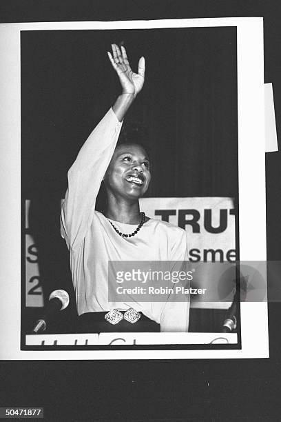 Law prof. Anita Hill who made sexual harassment allegations against Supreme Court nominee Clarence Thomas, waving at podium after making opening...