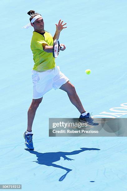 Marcos Baghdatis of Cyprus plays a forehand in his match against Pablo Carreno Busta of Spain during day two of the 2016 Kooyong Classic at Kooyong...