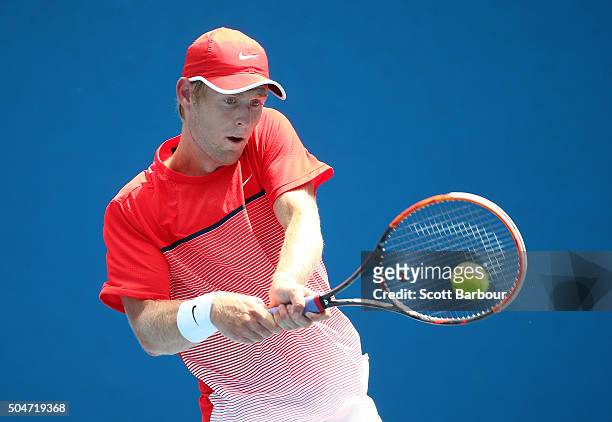 Luke Saville of Australia plays a backhand in his match against Amir Weintraub of Israel during round one of 2016 Australian Open Qualifying at...