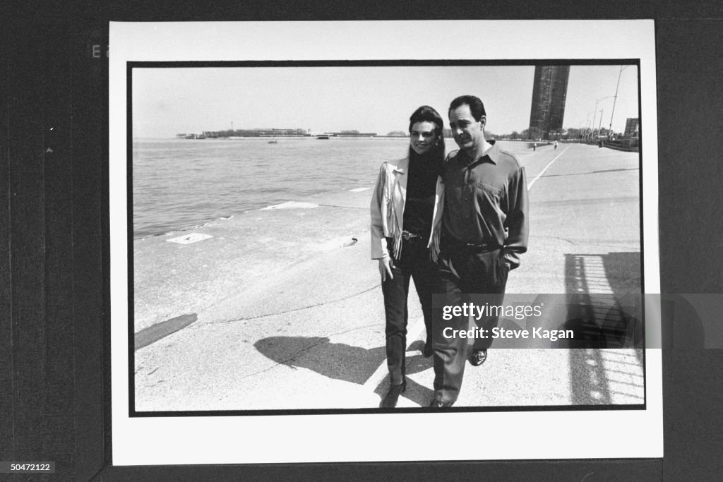 Actor Barry Williams w. his singer wife Diane Martin walking on road