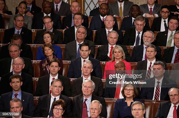 Members of congress including Republican presidential candidate Sen. Marco Rubio listen to US President Barack Obama deliver the State of the Union...